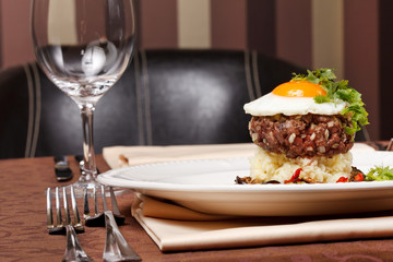 beef burger with egg and potatoes