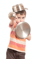 Little boy play knight with kitchen utensil