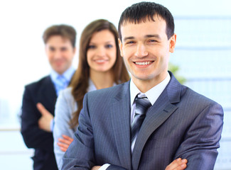 Portrait of a successful businessman standing with arms