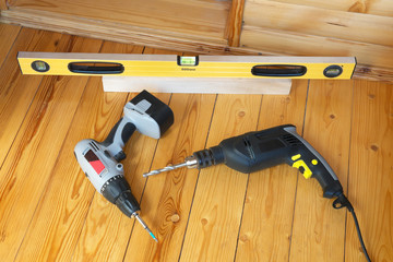 Tools for repairs on the old wooden floor