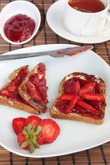 Toast with strawberry jam and tea