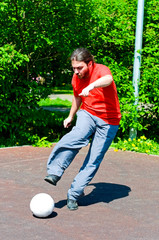 young man playing soccer