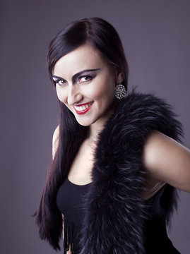 Beauty woman smile in fur boa - retro make-up