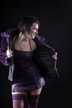 Young Girl Posing In Purple Fur Coat