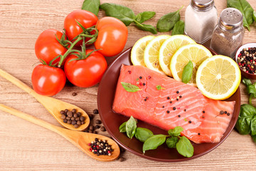 Red fish, lemon, pepper and tomato