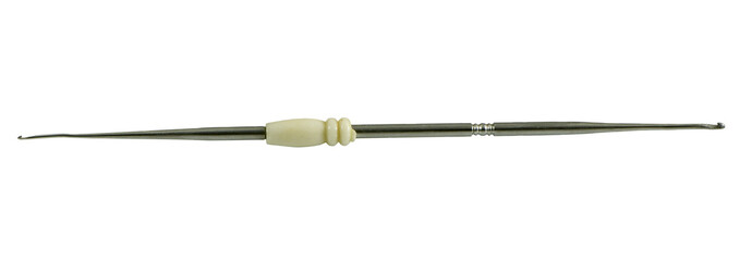 Fototapeta premium antique double crochet hook with ivory on a white background