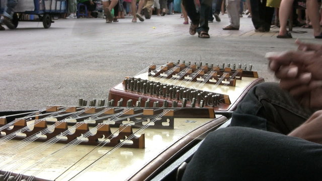 Playing The Khim-Thai Instrument