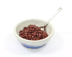 Cooked aduki beans in bowl with spoon