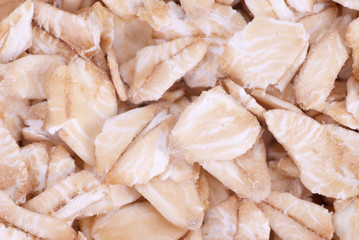 Oatmeal flakes close up as background