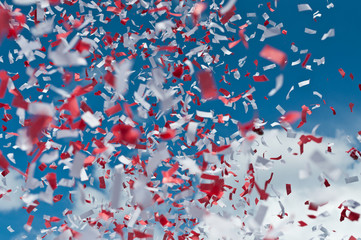 Red and White Confetti in the Air
