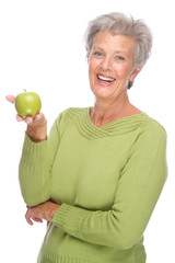 Senior woman with apple