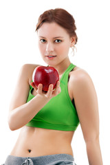 Fototapeta premium woman in sportswear with apple
