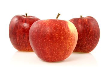three red apples over  a white background