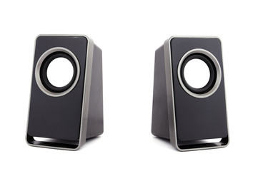 two computer speakers - Powered by Adobe