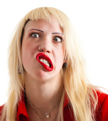 Portrait of a mad blonde woman with crazy facial expression