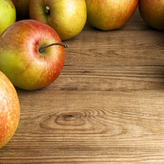 red apples on wooden table