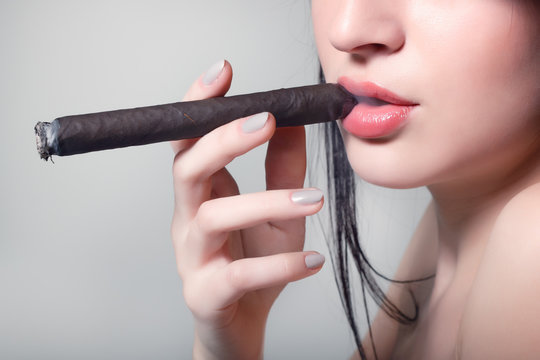 sexy smoking beautiful woman cigar closeup