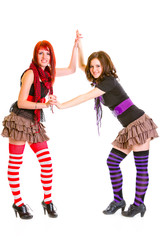 Two pretty teen girlfriends standing together