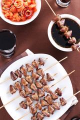 Grilled chicken hearts on skewers