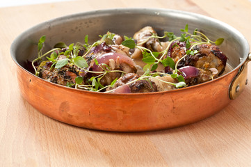 Chicken with thyme in pan