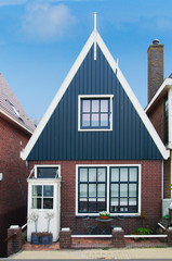 Dutch traditional house over blue sky, Netherlands
