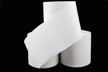 Stack of toilet paper on black
