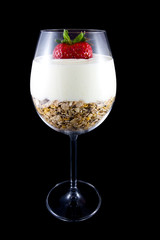 Musli and yogurt in a wine glass