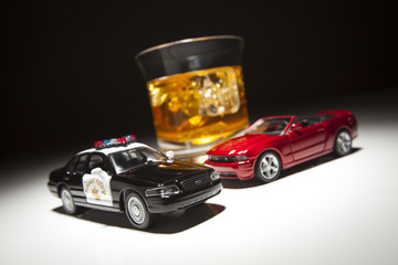 Police and Sports Car Next to Alcoholic Drink