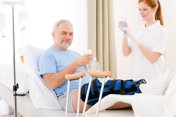 Hospital - female nurse syringe patient broken leg