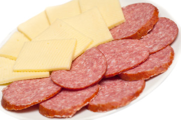 Sliced sausage and cheese on white