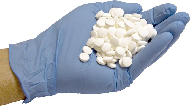 handfull of pills isolated