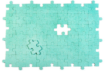 Green puzzle with missing piece