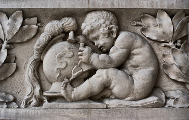 Child sculptor on a frieze