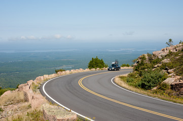 Car driving up Cadillac Mountain drive in Acadia national park, Maine, USA