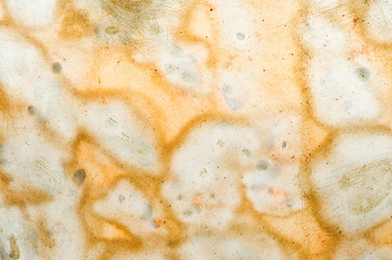 metallic grunge background of cracks and speckles