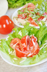 Tomatoes with mayonnaise on lettuce leaf