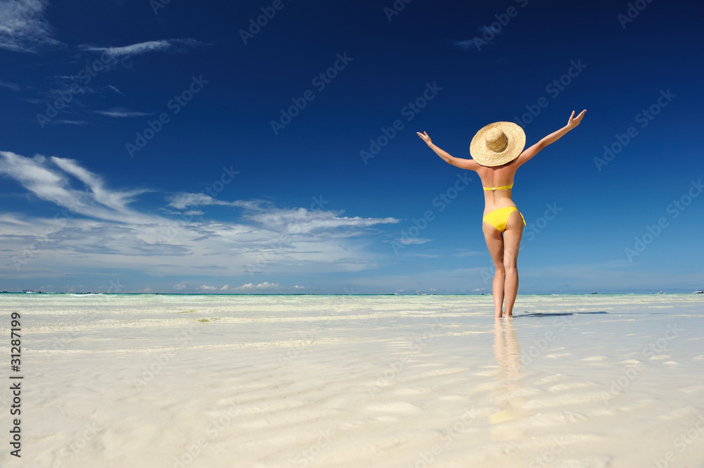 Wall mural girl on a beach