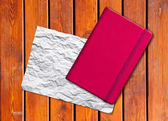 White blank page note book on wood table horizontal