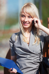 Fototapeta premium Young businesswoman on the phone