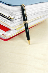 Many files and a pen