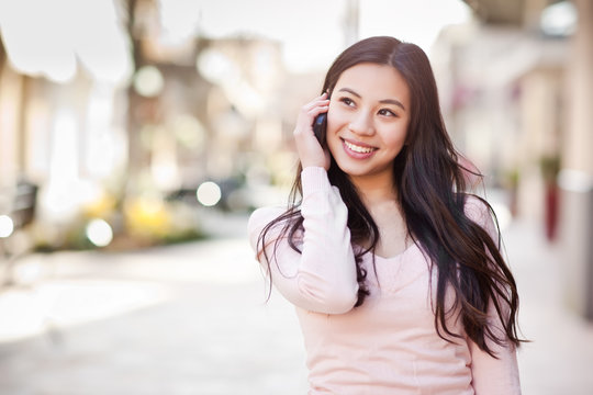 Asian woman on the phone