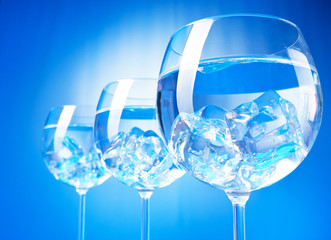 Water in the glass against gradient background