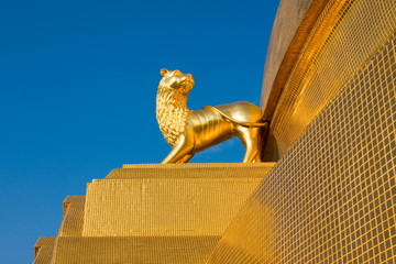 A golden lion, Thai art of temple in Thailand.