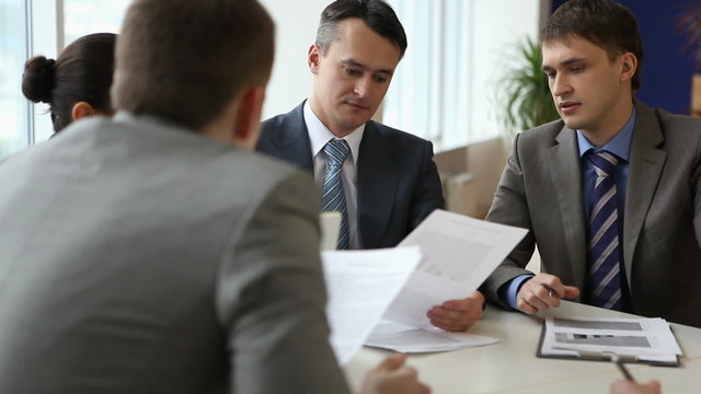 Businesspeople sitting at the boardroom