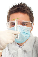 Close up of biologist holding new plant