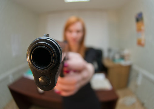 The armed woman at office