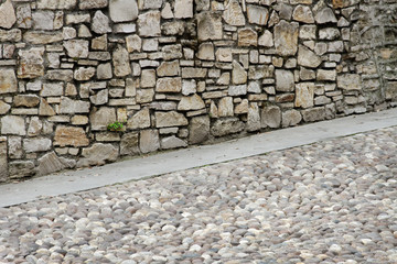 Wall and pavement.