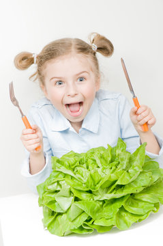 Vegetarian food - little girl with butterhead lettuce