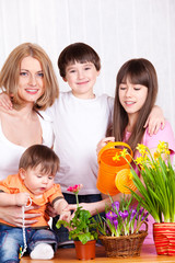 Family watering flowers