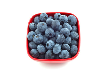 Blueberries in red dish